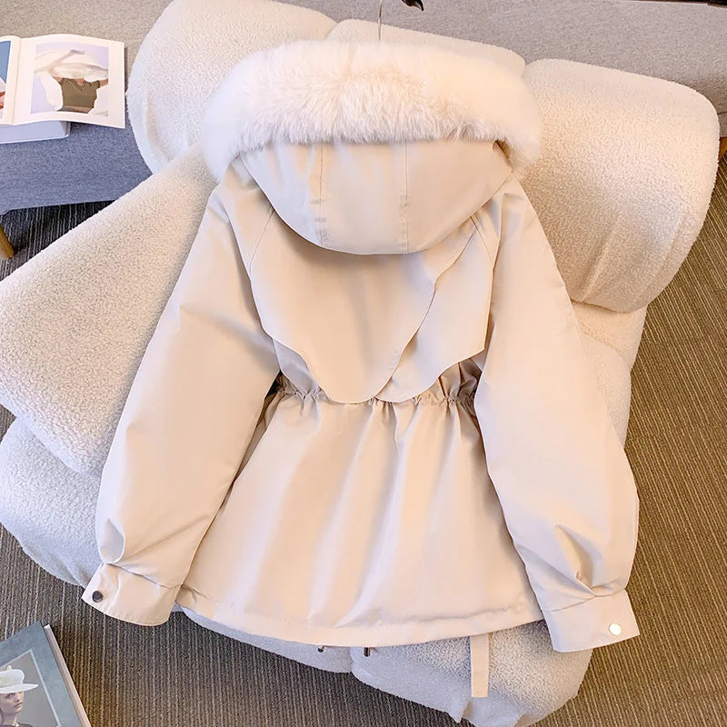 Elegant women's coat with faux fur collar