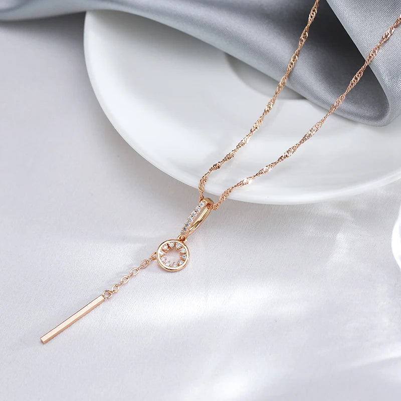 Elegant gold-toned necklace with round crystals